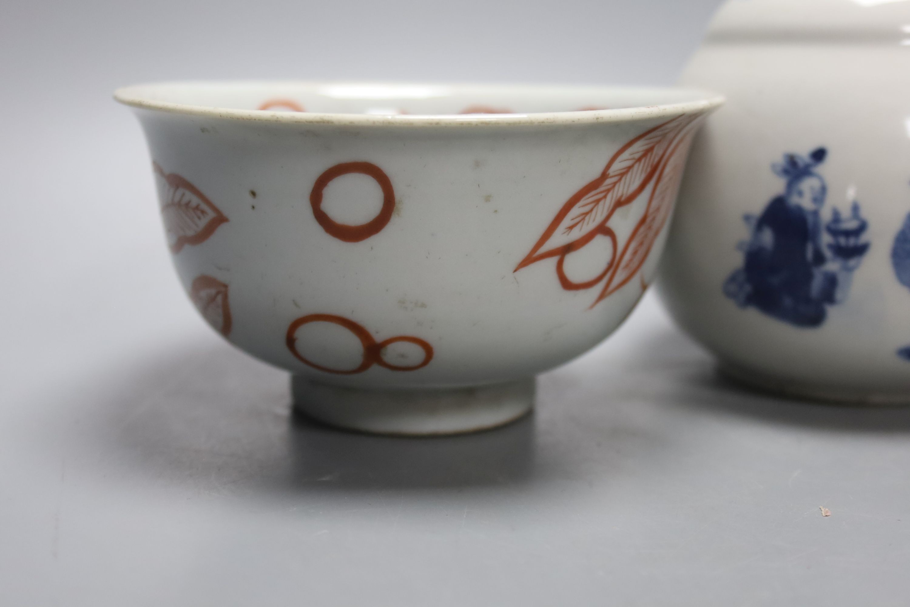A Chinese blue and white water pipe vessel, a doucai stem dish and a Japanese Imari bowl, 19th century, (3)